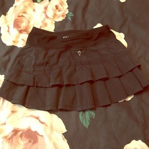 Girls Ivivva (lululemon) black ruffle skort.